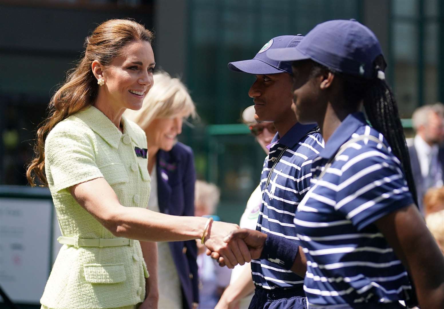 The Princess of Wales speaks to ball boys and girls (Victoria Jones/PA)