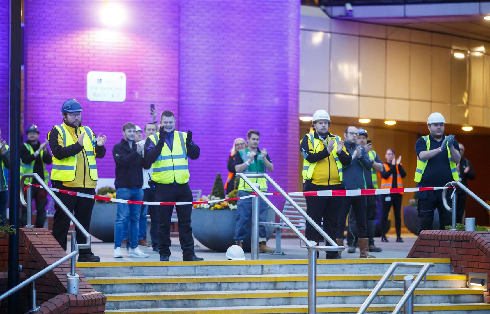 Construction workers clapping outside the Nightingale Hospital at the Harrogate Convention Centre (Danny Lawson/PA)