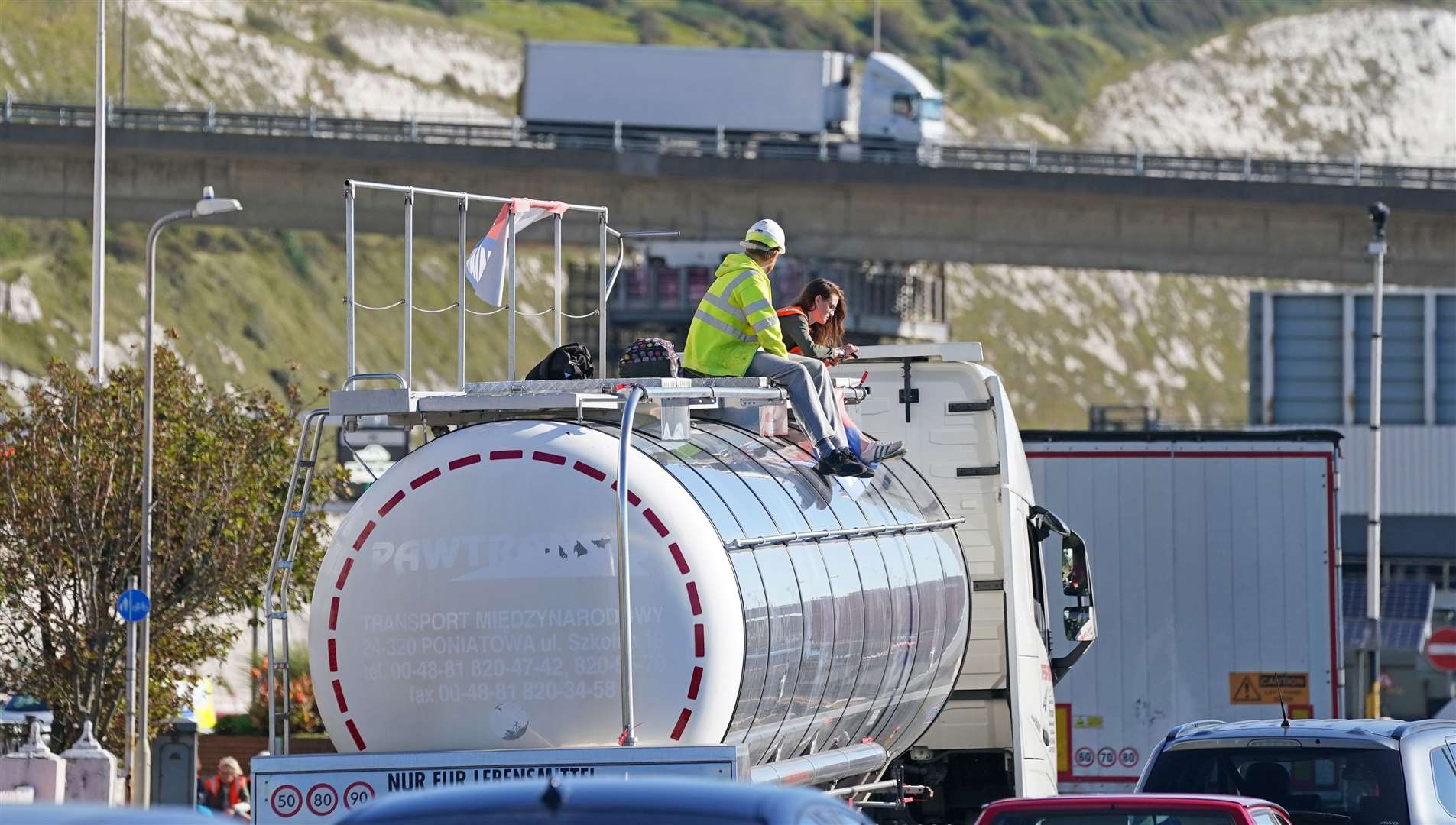 Protesters from Insulate Britain sit on top of a vehicle (Gareth Fuller/PA)