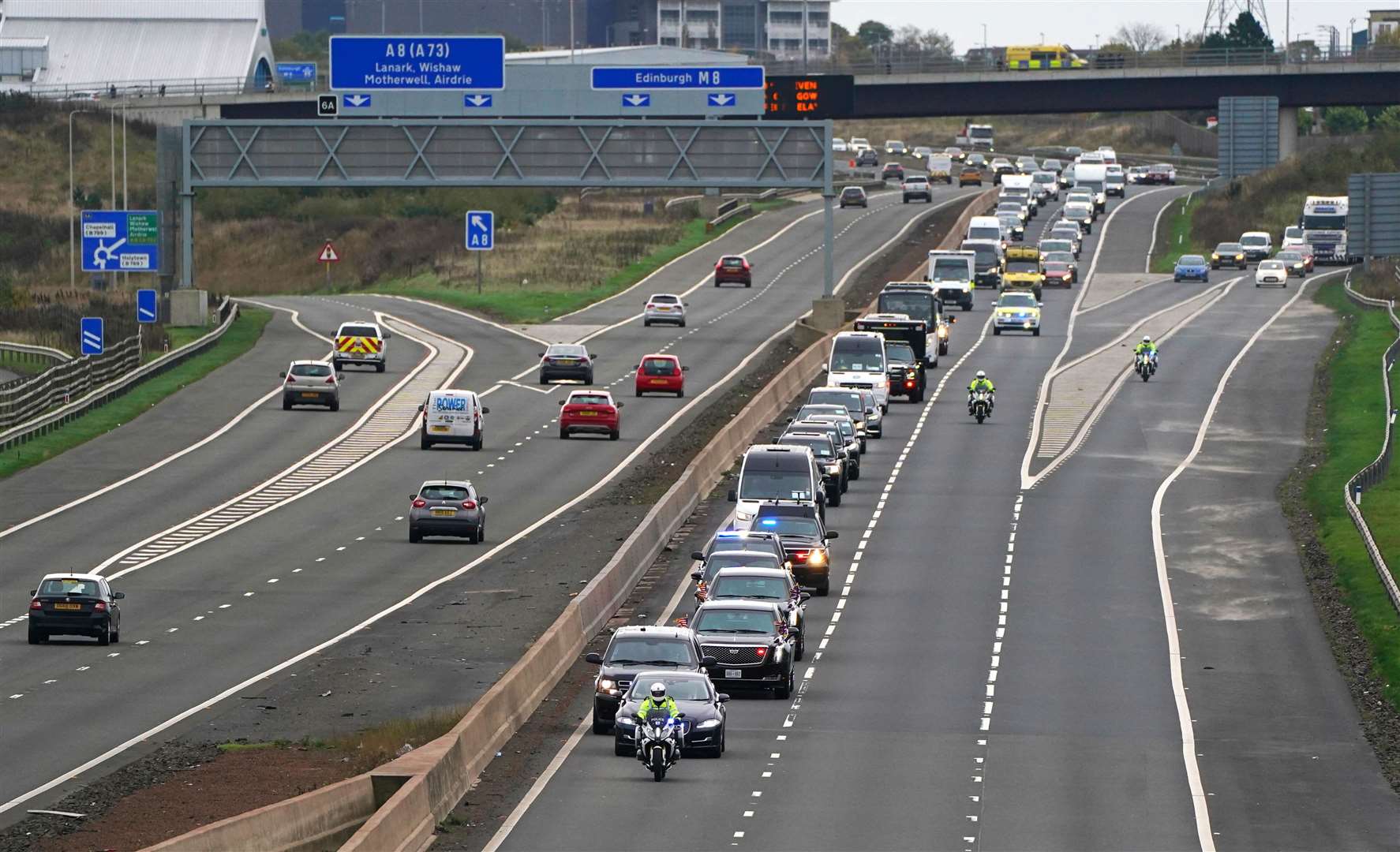 The motorcade of US president Joe Biden heads along the M8 motorway towards the Cop26 summit (Andrew Milligan/PA)