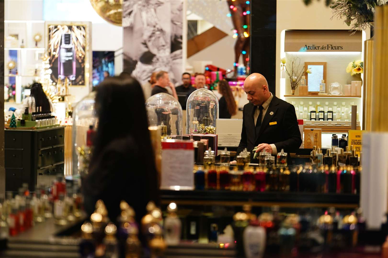 A member of staff at Selfridges in London’s Oxford Street prepares for the store’s Boxing Day sale (Jordan Pettitt/PA)