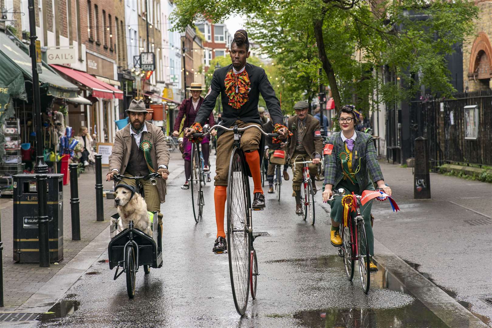 Dogs and penny farthings were on show during the annual cycling event in London (Jeff Moore/PA)