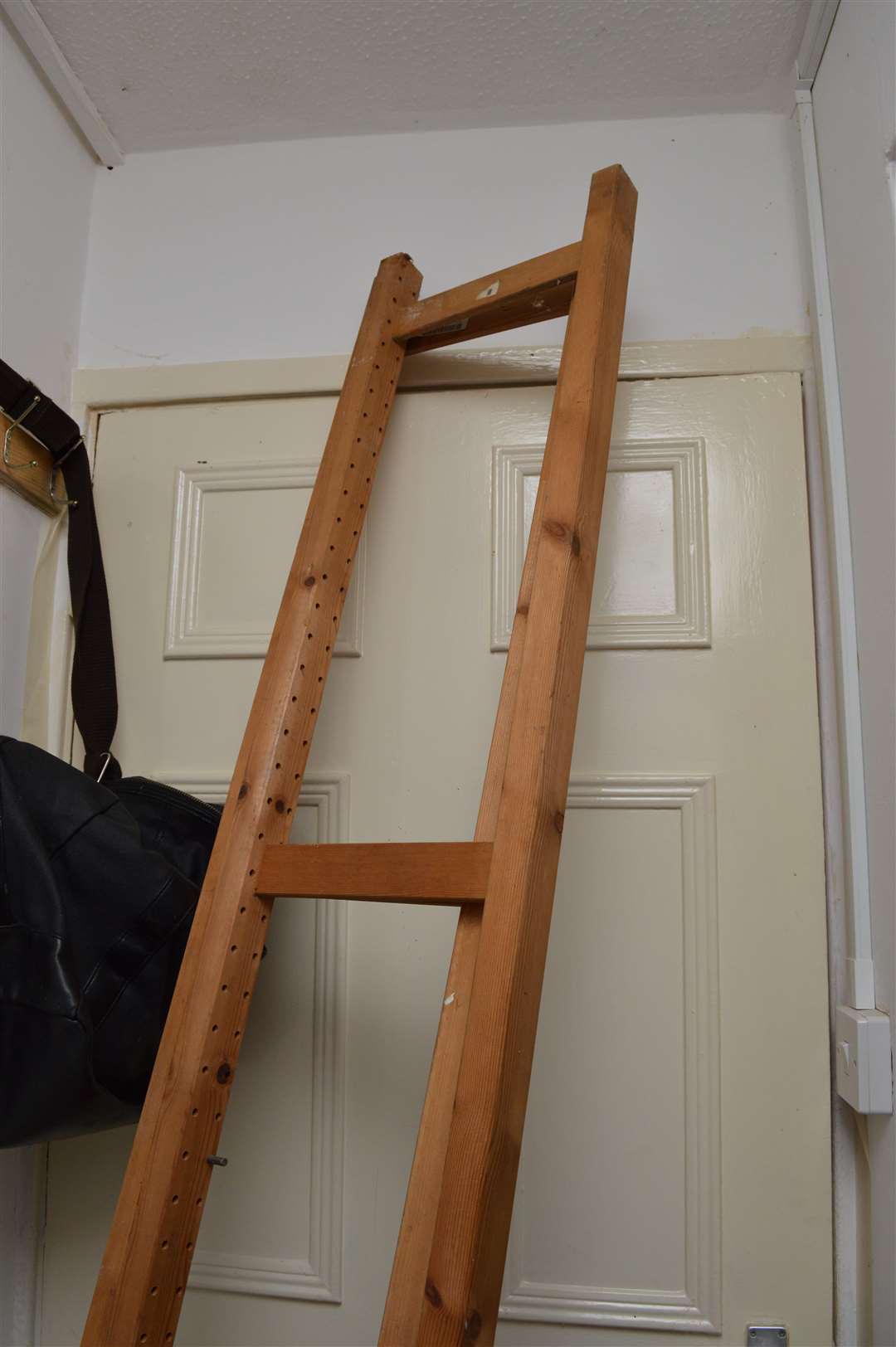 A door to a cupboard in the home of Zahid Younis where police found two bodies stored in a freezer (Metropolitan Police/PA)