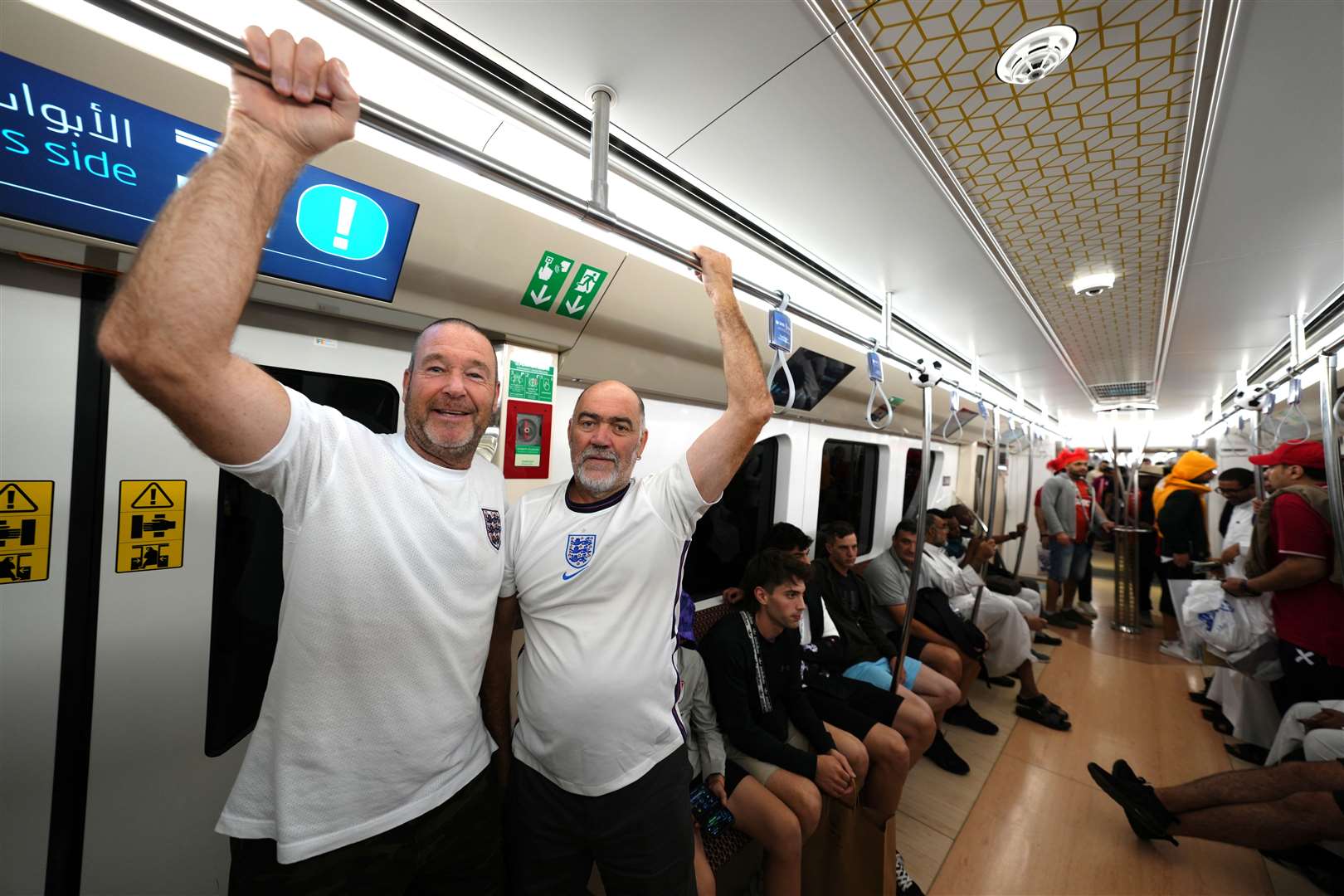 England fans Simon and Kevin on the Metro to the ground before the Fifa World Cup Quarter-Final match at the Al Bayt Stadium (Nick Potts/PA)