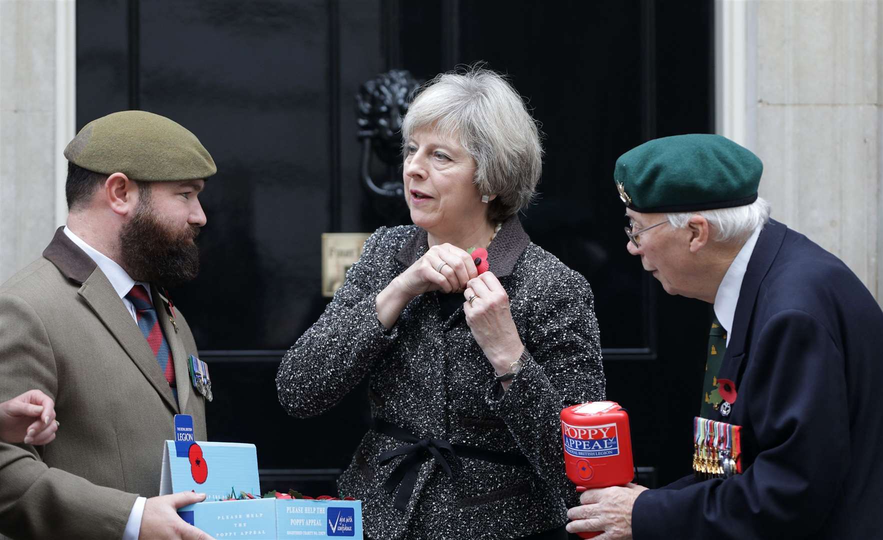 Theresa May questioned the decision to ban Remembrance Day services inside places of worship (Yui Mok/PA)