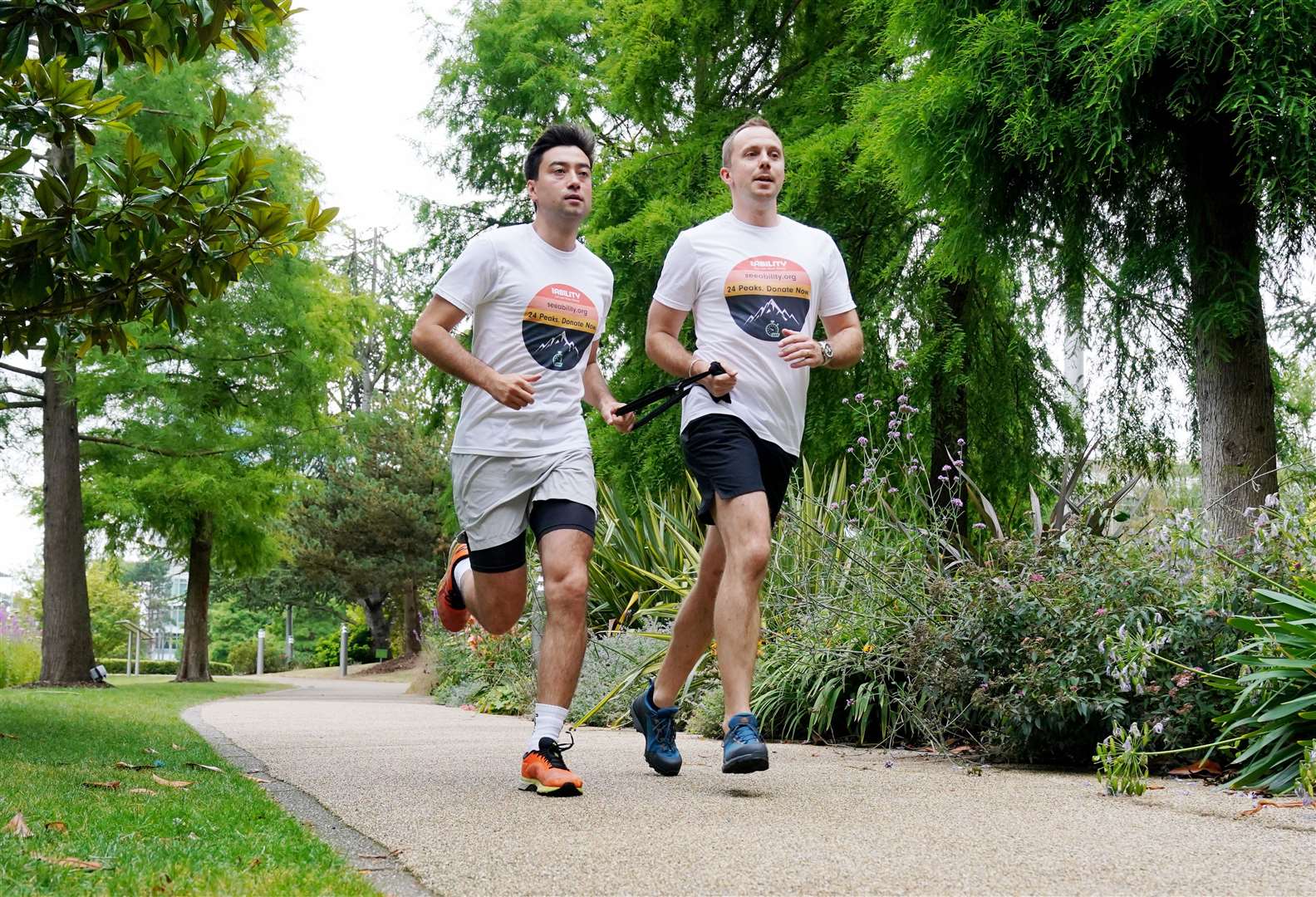 Michael Smith (left), who lost his sight 15 years ago, hopes the 24 peaks in 24 hours challenge will encourage people with disabilities to pursue their ambitions (Jonathan Brady/PA)