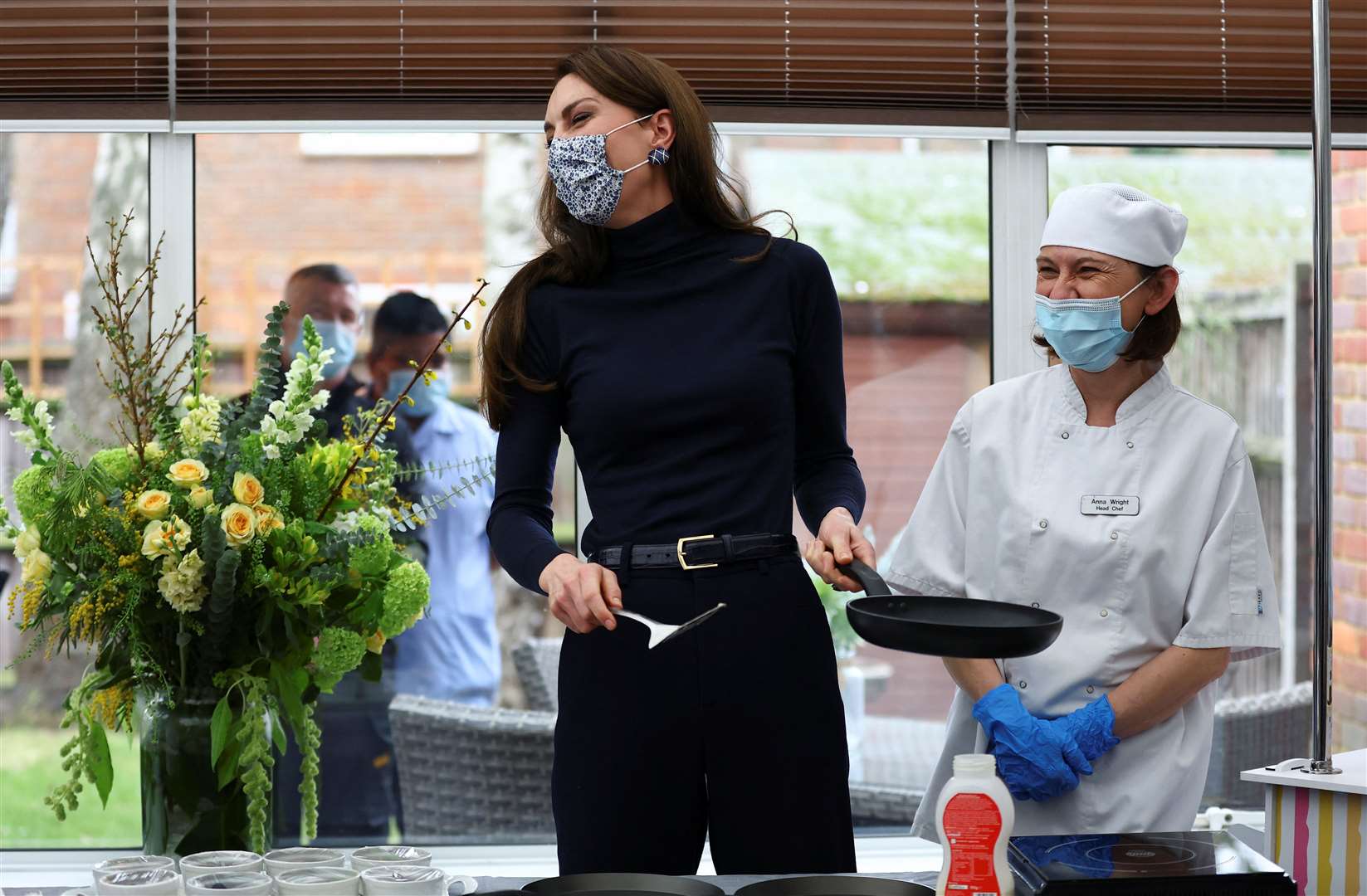 Kate joked about her Shrove Tuesday efforts – but was given a round of applause after successfully tossing a pancake (Hannah McKay/PA)