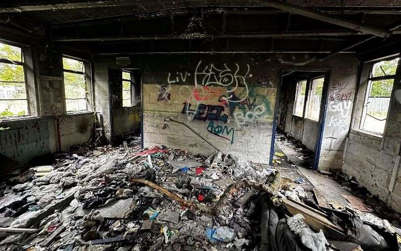 Both the ceilings and walls appear in a very bad state, with litter also scattered across the floor