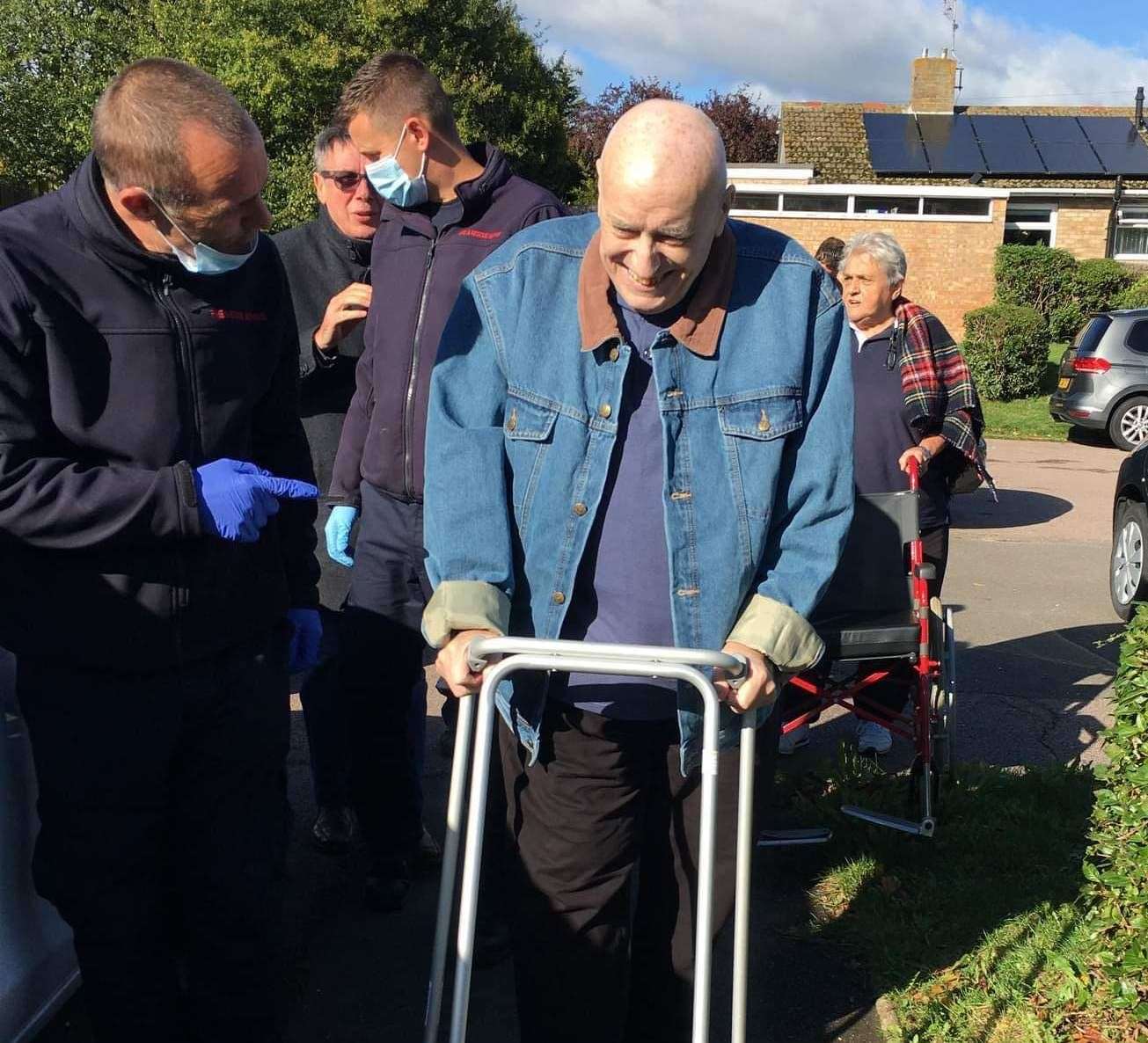 Gordon Foreman, 77, is helped down his steps at his home in Whitstable. Picture: Sylvia Foreman