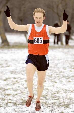 Mike Coleman celebrates as he crosses the line