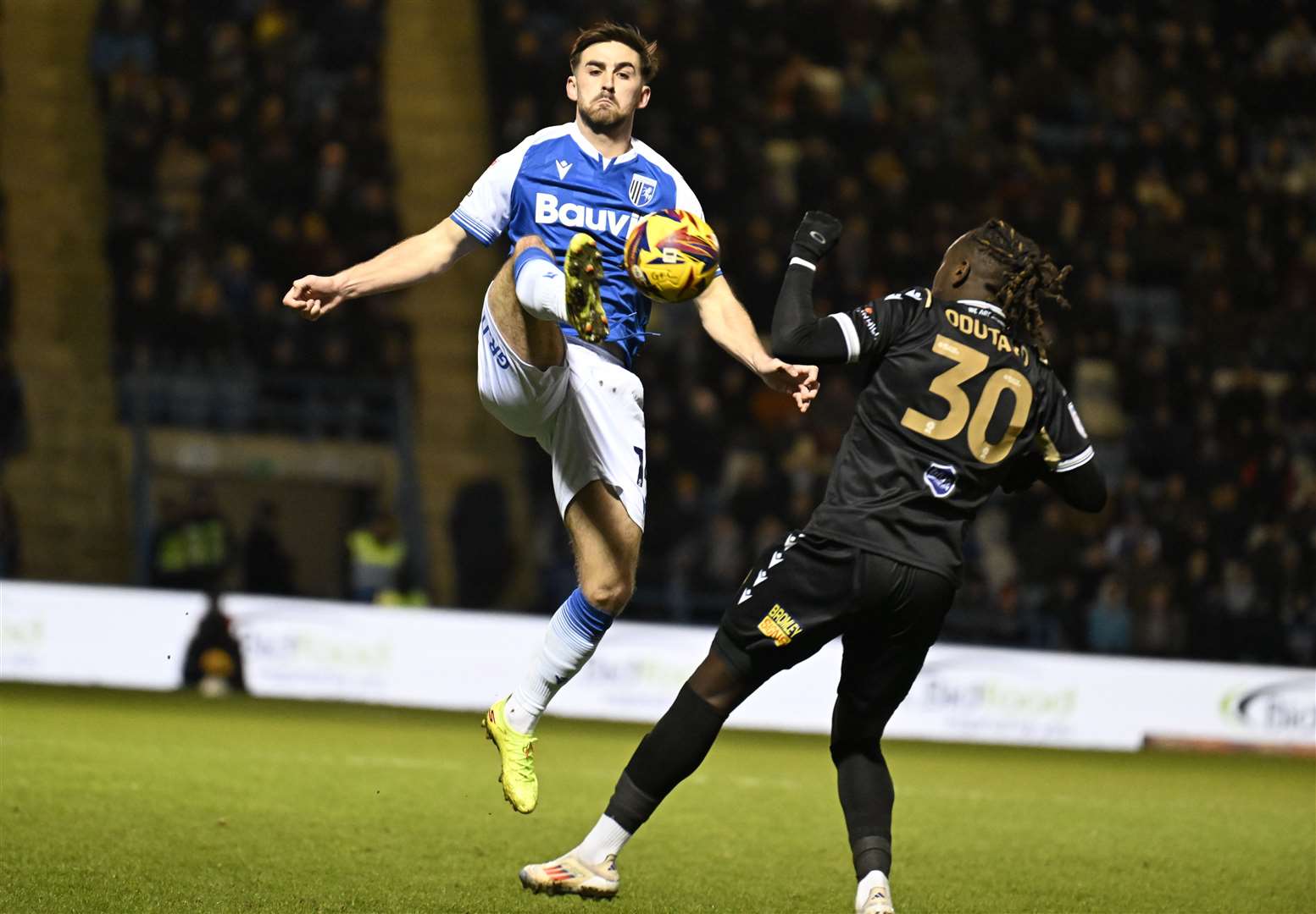 Gills’ Robbie McKenzie gets ahead of Bromley’s Idris Odutayo. Picture: Barry Goodwin