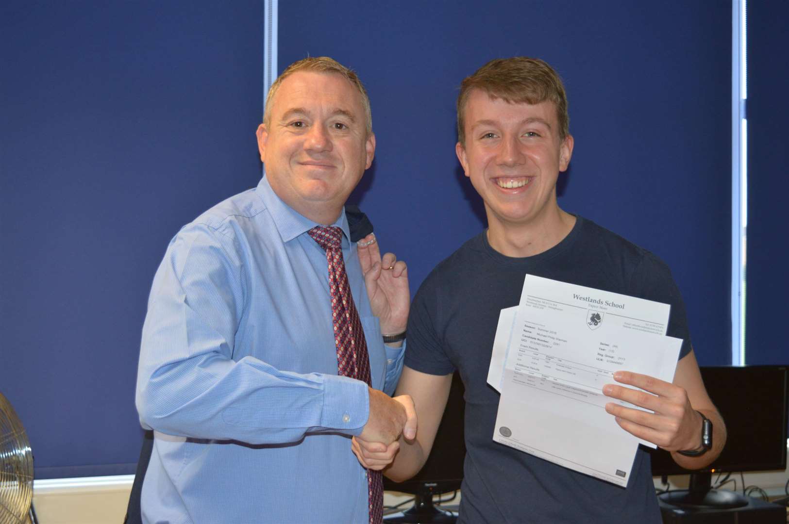 Westlands head Simon Cox congratulates Michael Warman on his results (3637357)