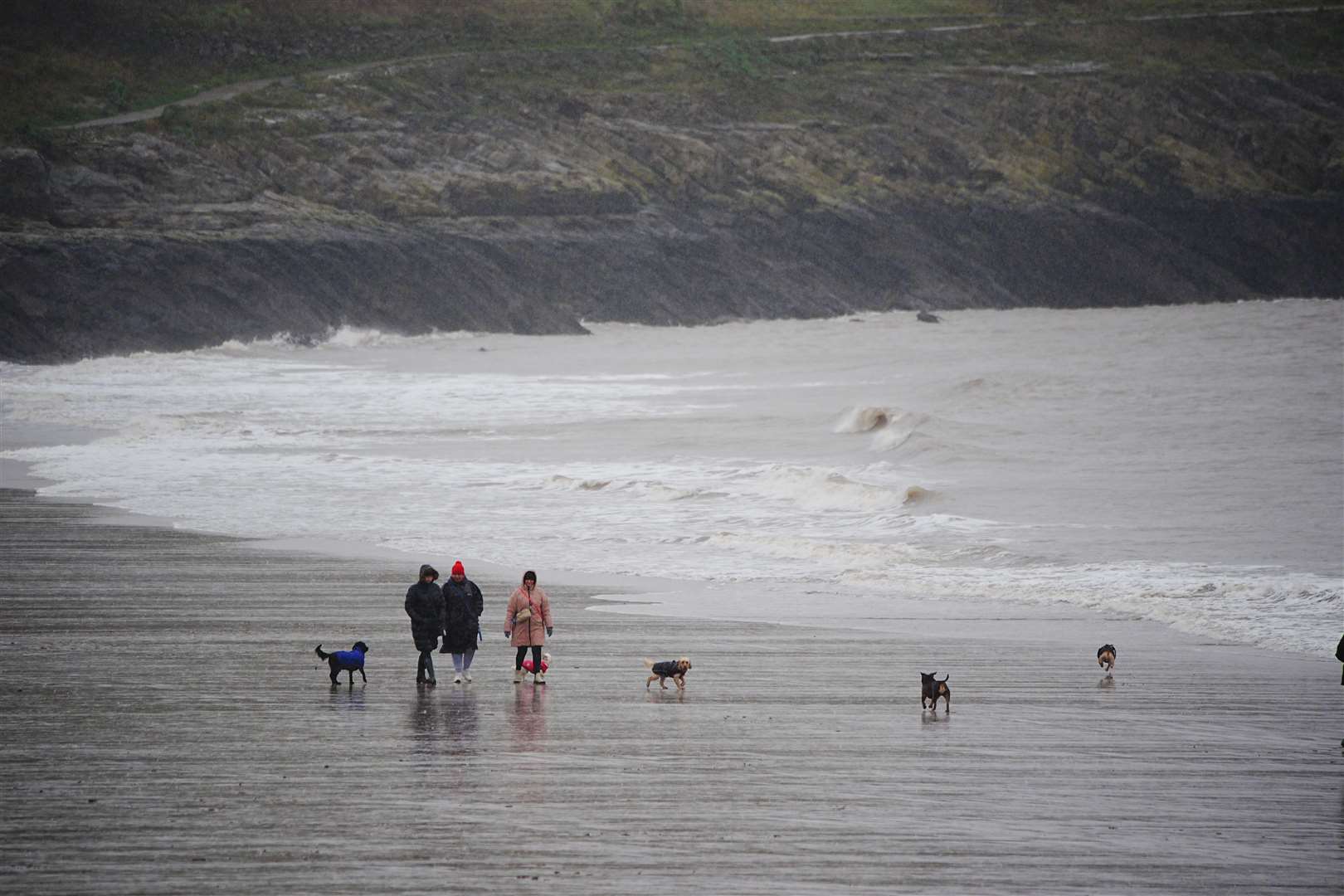 People walking on the beach in Barry Island, in the Vale of Glamorgan (Ben Birchall/PA)