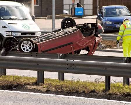 The car was on its roof and missing a wheel. Picture: Nick Johnson.