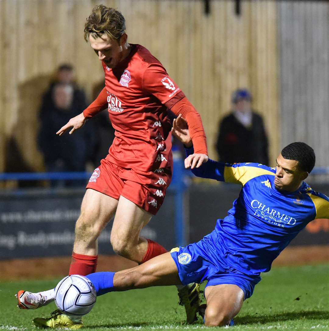 Dover's Collinge is challenged by Malachi Linton. Picture: Tim Smith