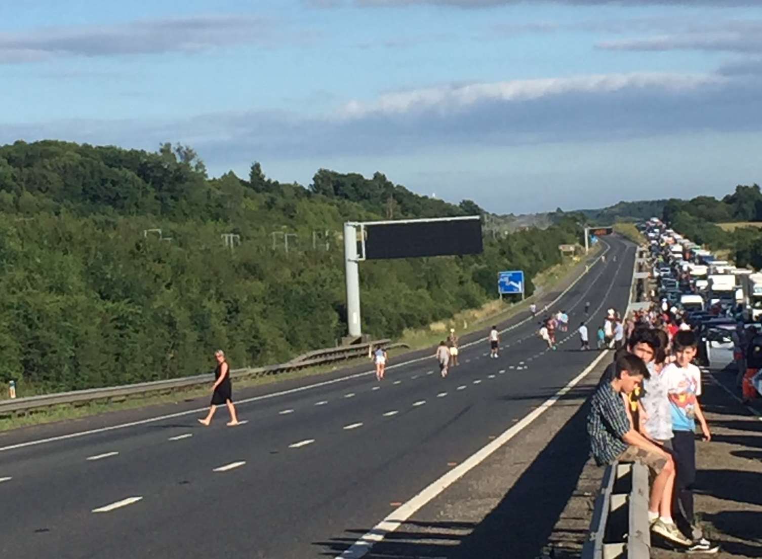 Some motorists are playing football on the carrriageway