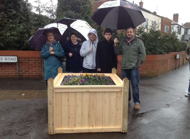 Walmer in Bloom Chairman Cllr Sue Le Chevalier, committee member Mrs Shorten, Ripplevale teacher Simon Jackson and pupils by the new planter