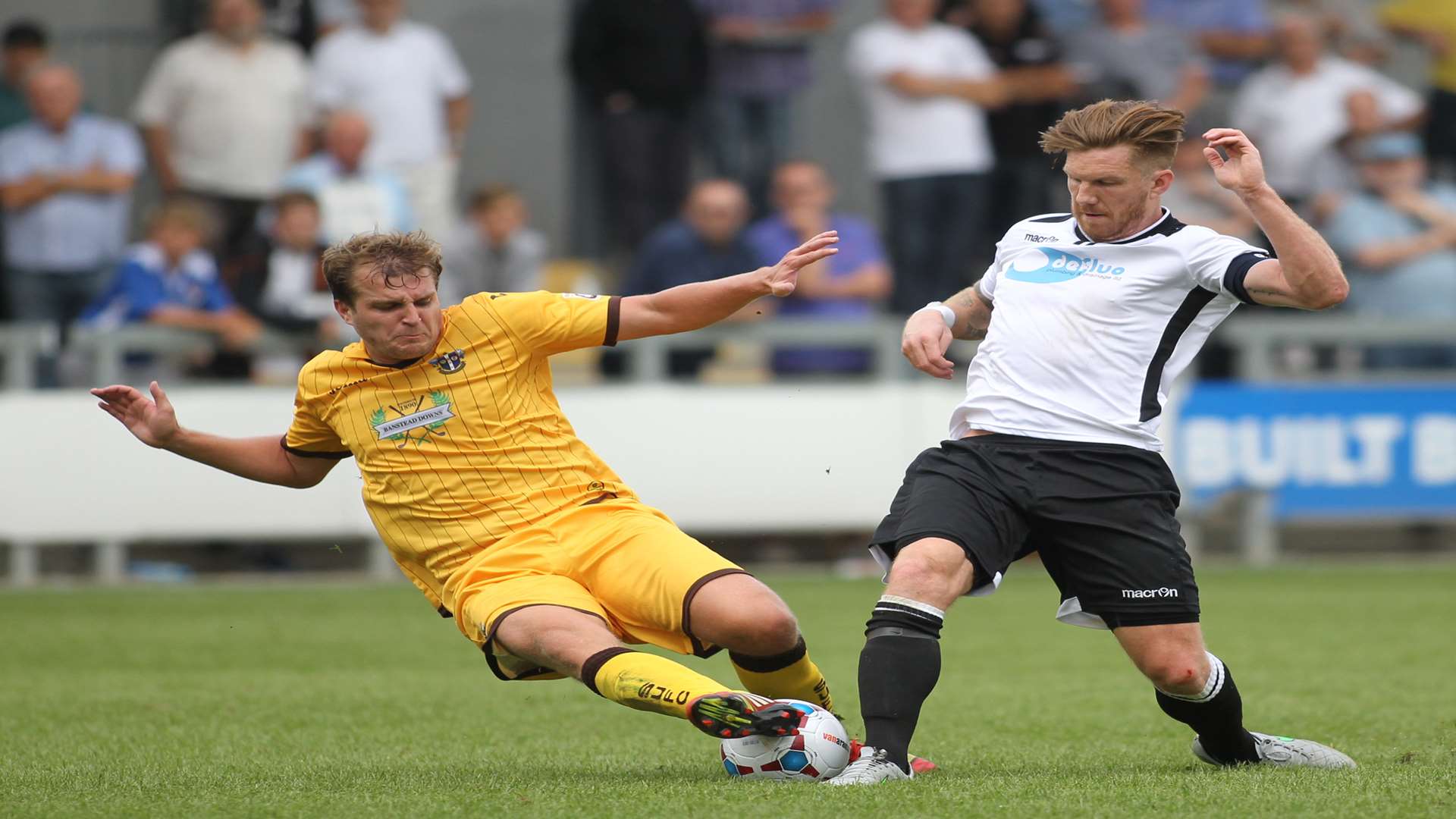 Elliot Bradbrook stands his ground against Sutton's Jamie Collins Picture: John Westhrop