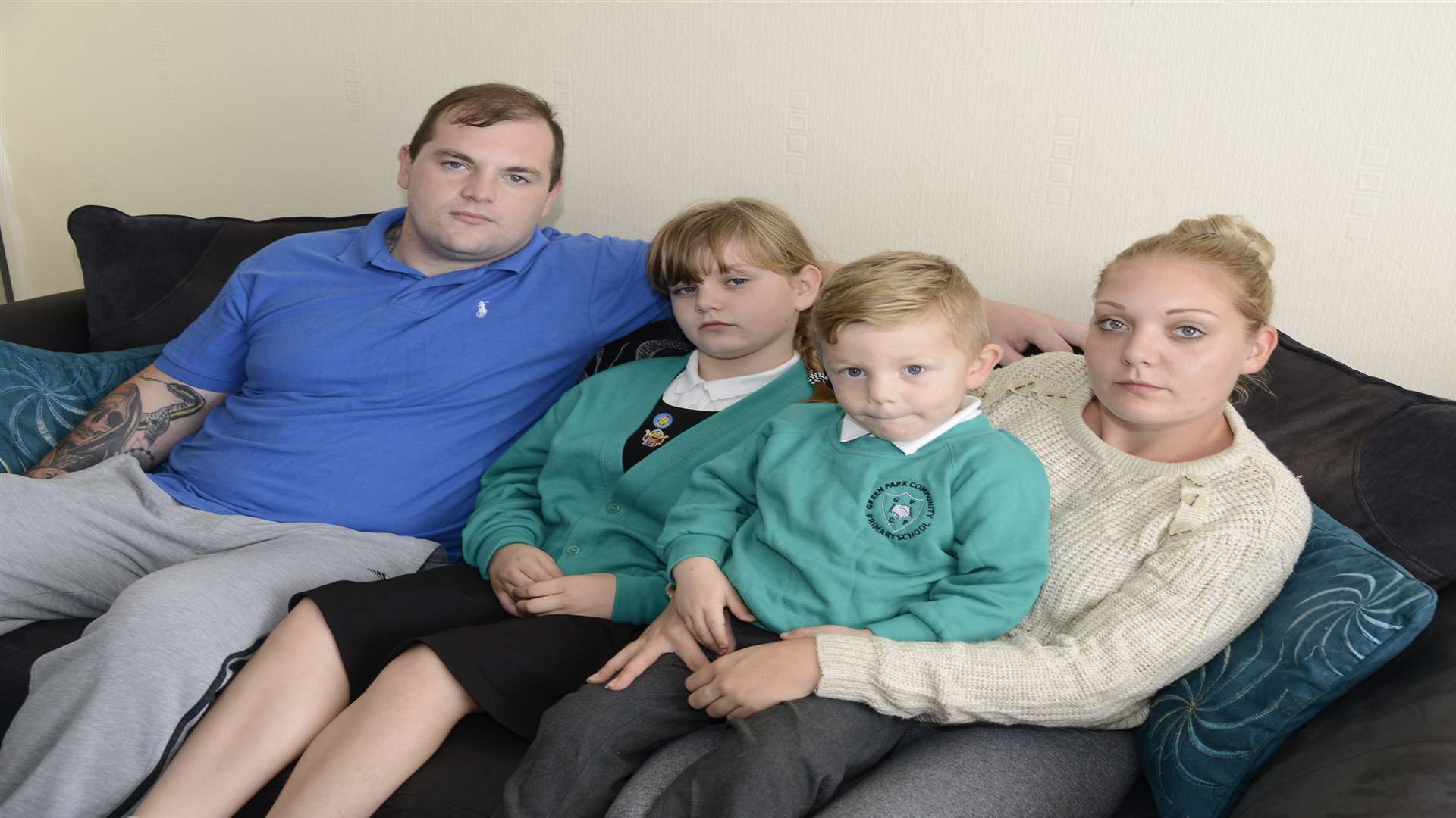 Chris Farmer and partner Kirsty Hammond with children Freya (8) and George (4), who are still frightened by their encounter with a burglar. Picture: Paul Amos