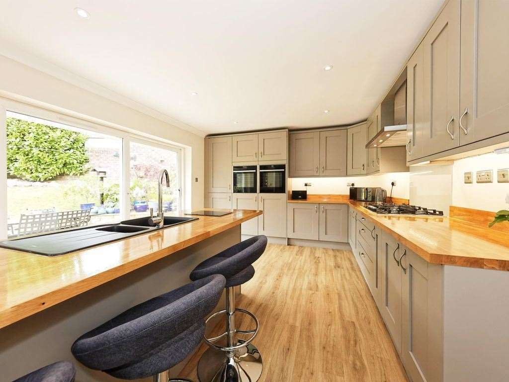 The bright modern kitchen opens up into the garden. Photo: Zoopla