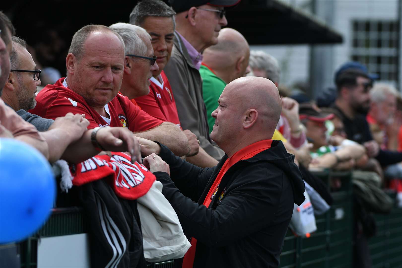 Ebbsfleet chief executive Damian Irvine, talking to fans before the play-off final at Dorking in May, will play a huge role in moving the club to a new stadium. Picture: Barry Goodwin