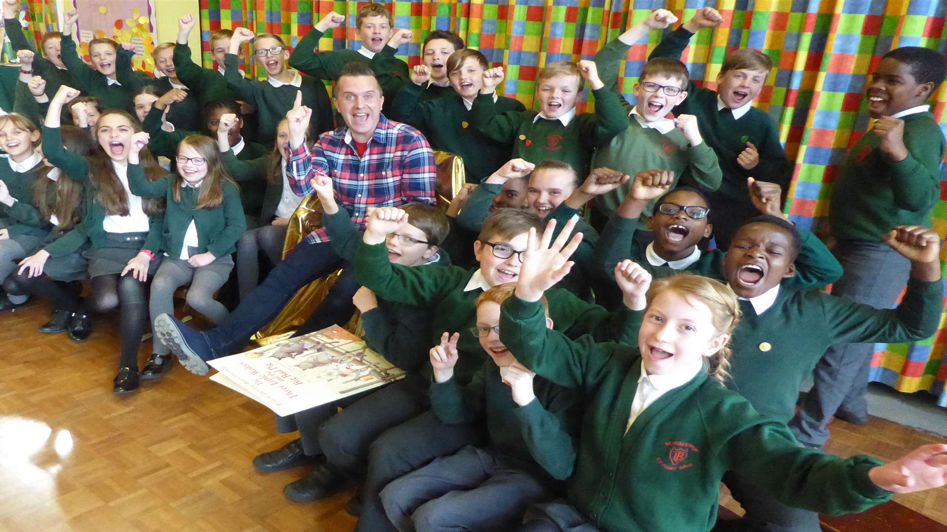 Phil Gallagher from the Mister Maker CBeebies TV show reads a story time session with Dunston Class at Bapchild & Tonge Primary School.
