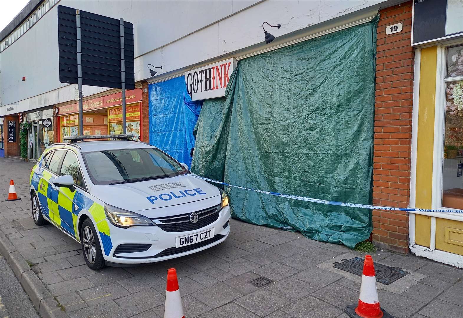 Police outside tattoo and piercing shop GothInk Studio in Lower Bridge Street today