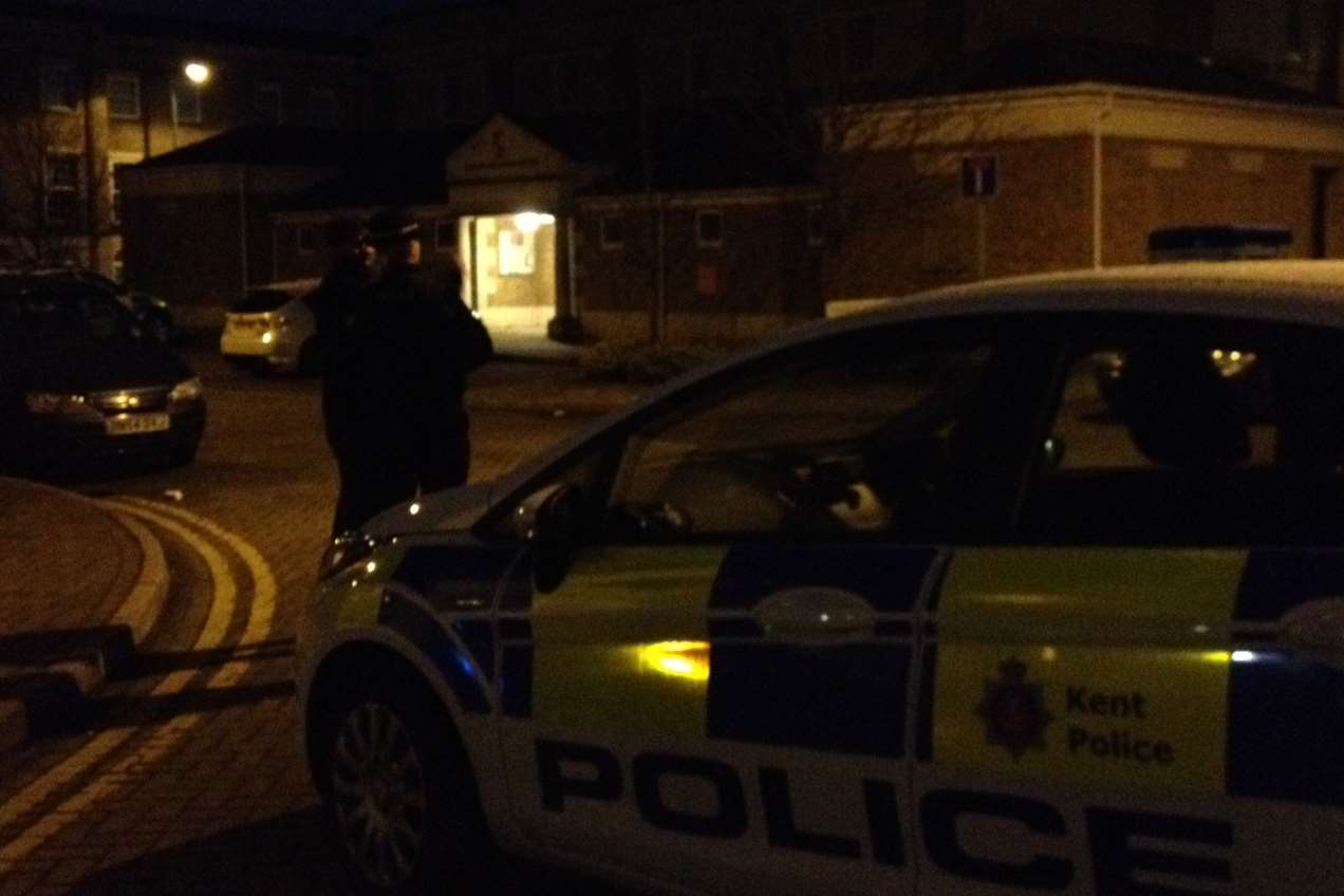 Police seal off entry to the estate at Marigold Way by the Beechwood Community Centre.