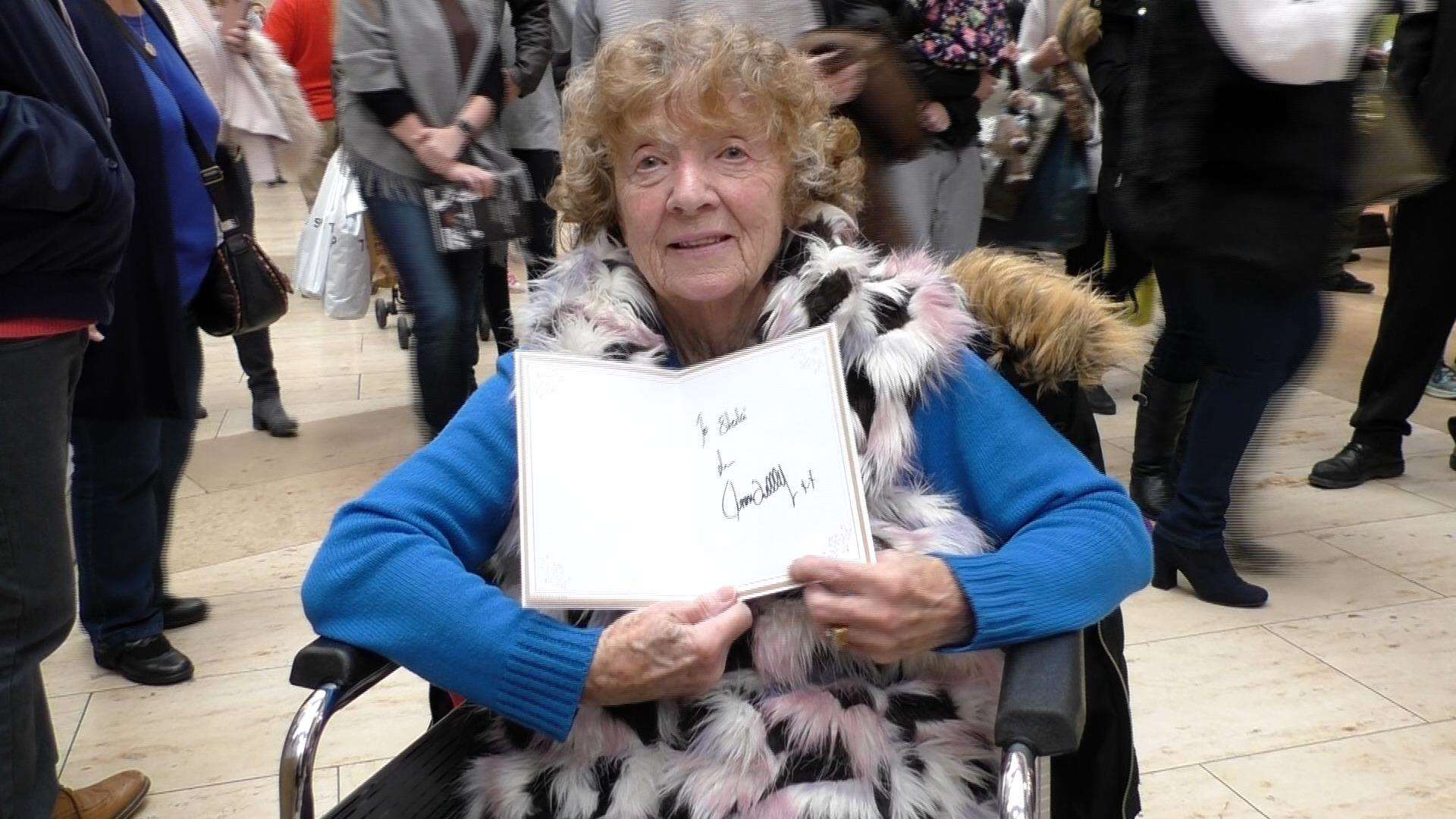 Sheila with the card signed by the snooker champion