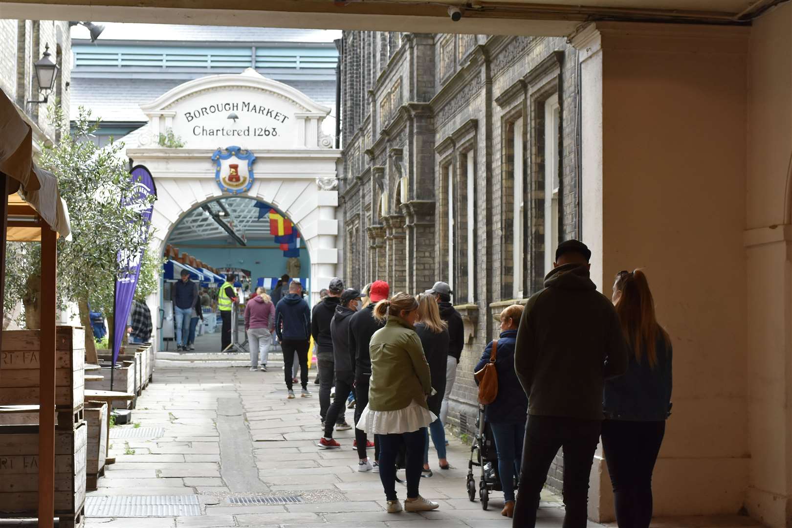 People queued for the re-opening of the food market after lockdown. Picture: Jason Arthur