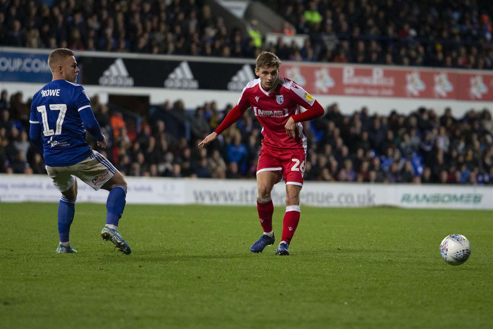 Henry Woods takes on Ipswich Town's Danny Rowe Picture: @KentProImages