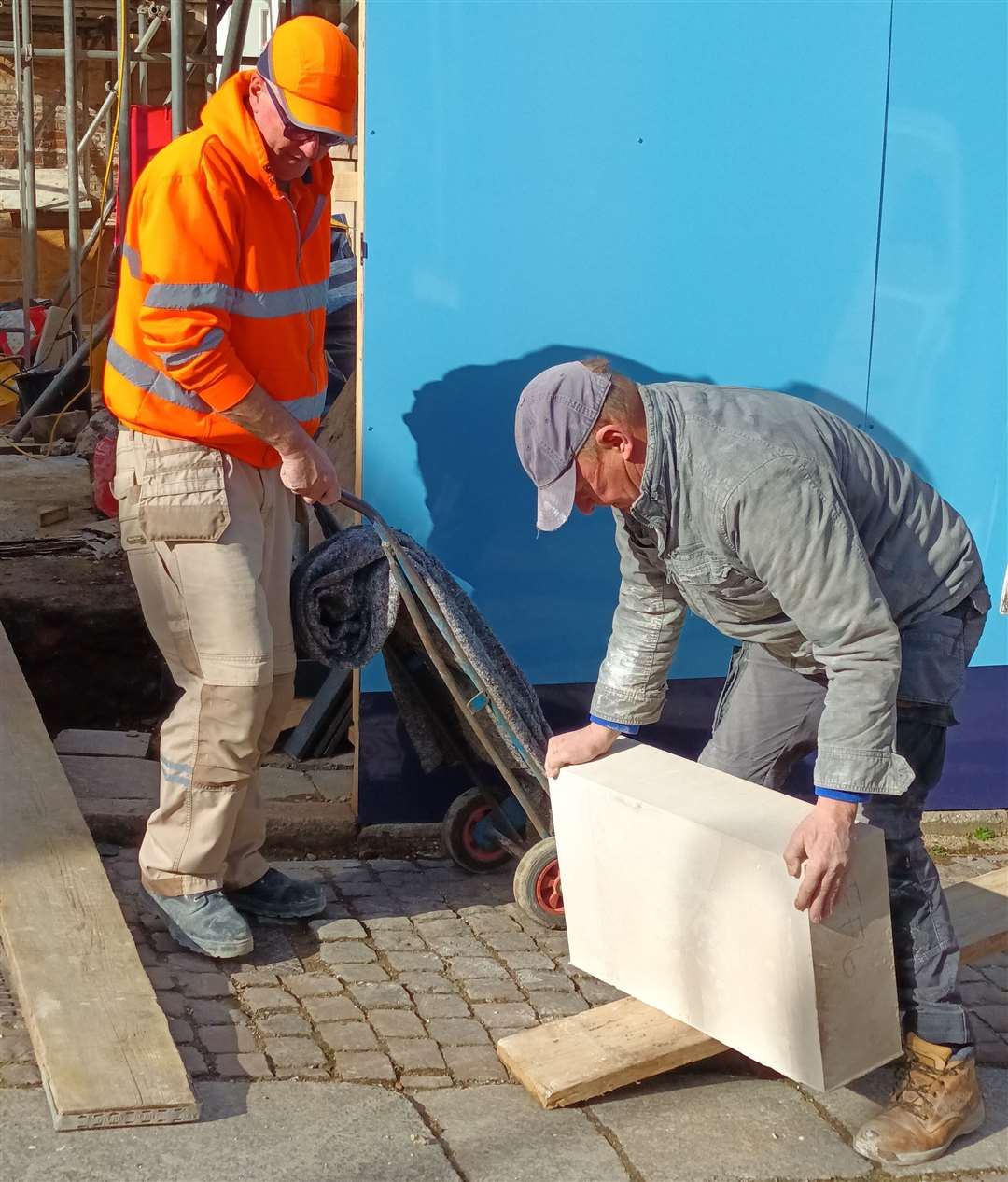 Stonemason Gary Newton handling Portland stone to be used for the front yard wall. Photo: Sheila Featherstone