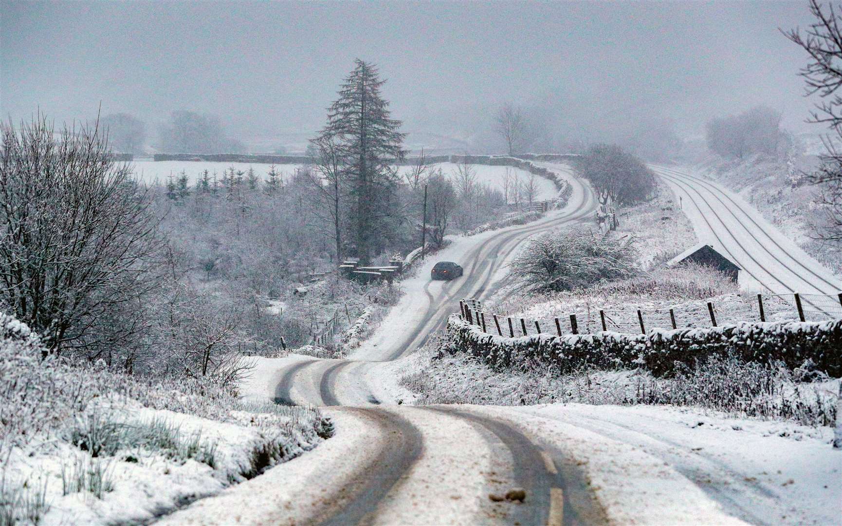 Roads were almost deserted in Garsdale, Cumbria, as the region saw snow, ice and freezing temperatures (Peter Byrne/PA)