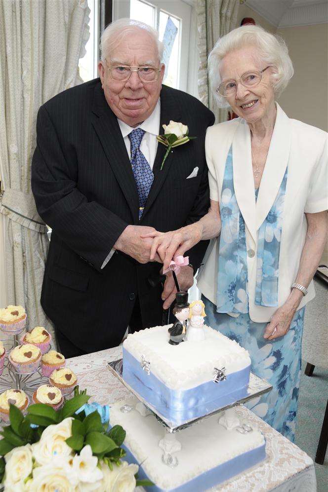 Cutting the cake... John and Phyllis start married life together