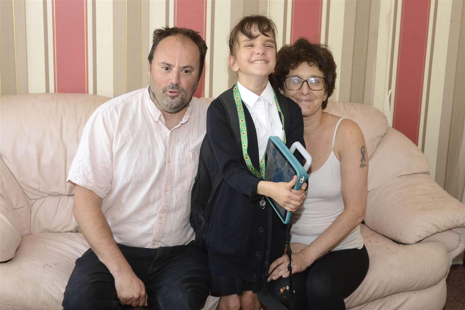 Ramsgate Teagan Martin in her new school uniform with a proud mum and dad.Picture: Paul Amos. (15777680)