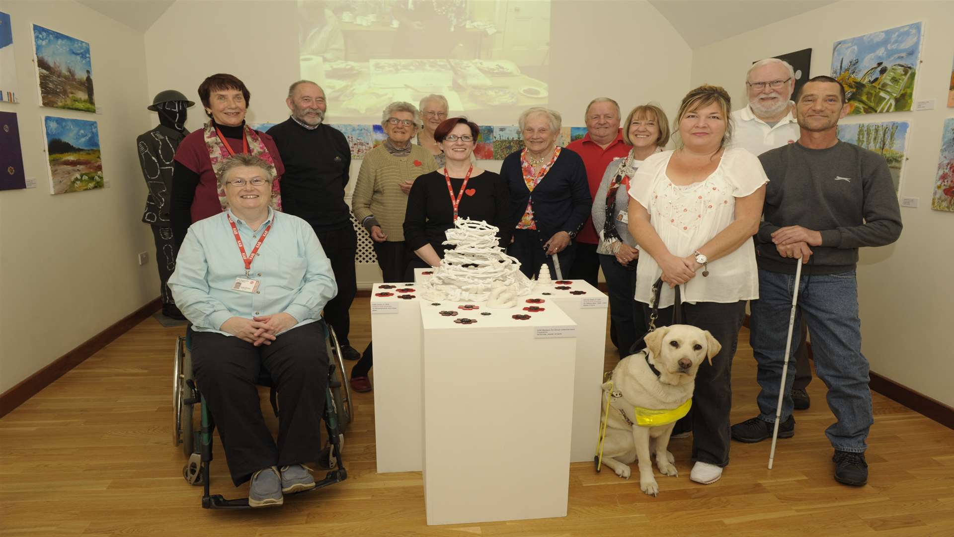 Wendy with visually impaired artists at their exhibition, Through Our Eyes, at the Royal Engineers Museum.
