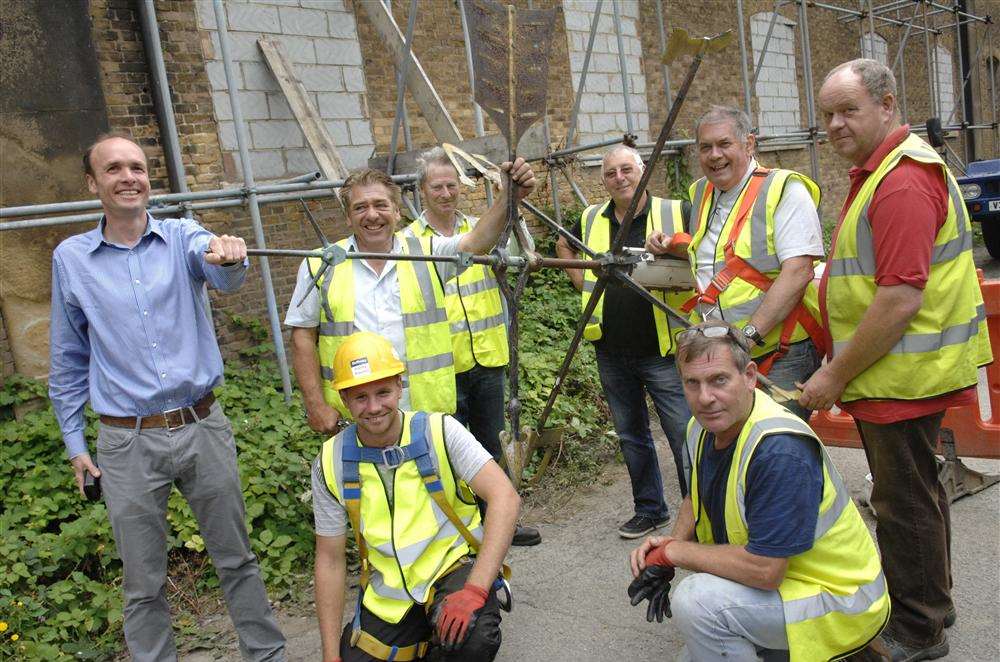 Will Palin with Brian Hole and Oliver Leigh-Wood, of The Spitalfields Trust, Tony Coulson, of Liftec, Peter Marchington and Mike Sheahan, of Powerlift, with Ben Coulson and Neil Bull, of Liftec, and the weather vane