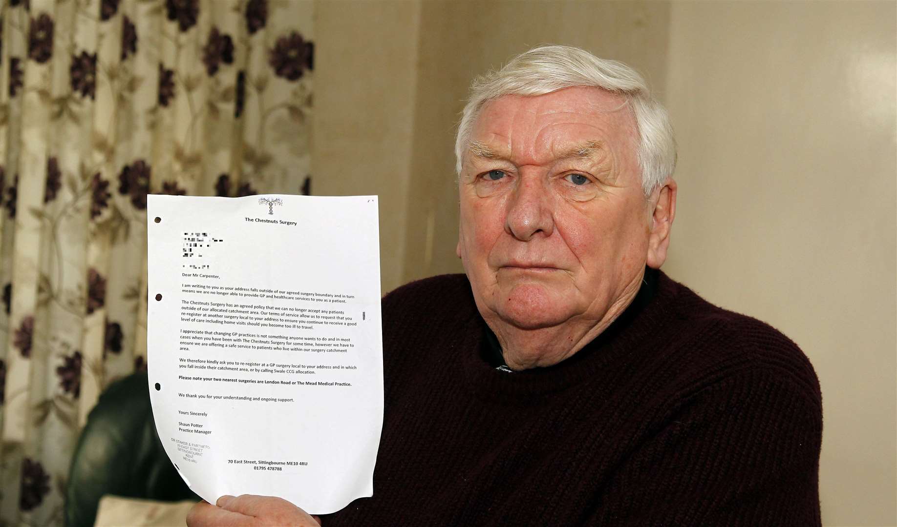 John Carpenter pictured at his home in Sittingbourne with the letter from his GP surgery