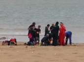 The boy is treated on the beach