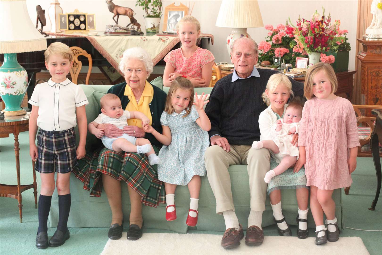 The Queen and Philip with seven of their great grandchildren – Prince George, Prince Louis, Savannah Phillips, Princess Charlotte, Isla Phillips holding Lena Tindall, and Mia Tindall (Duchess of Cambridge/PA)