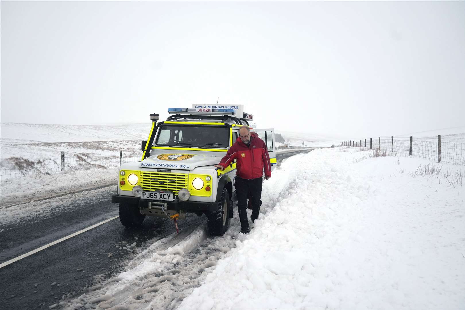 A member of a mountain rescue team after helping to clear cars from a snow drift near Ribblehead, in North Yorkshire (Danny Lawson/PA)