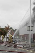 Firefighters getting to grips with the blaze. Picture: PETER STILL