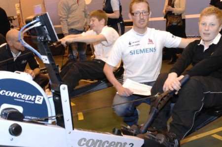 Alistair McKean of the British LTA Four Rowing Team instructs a youngster