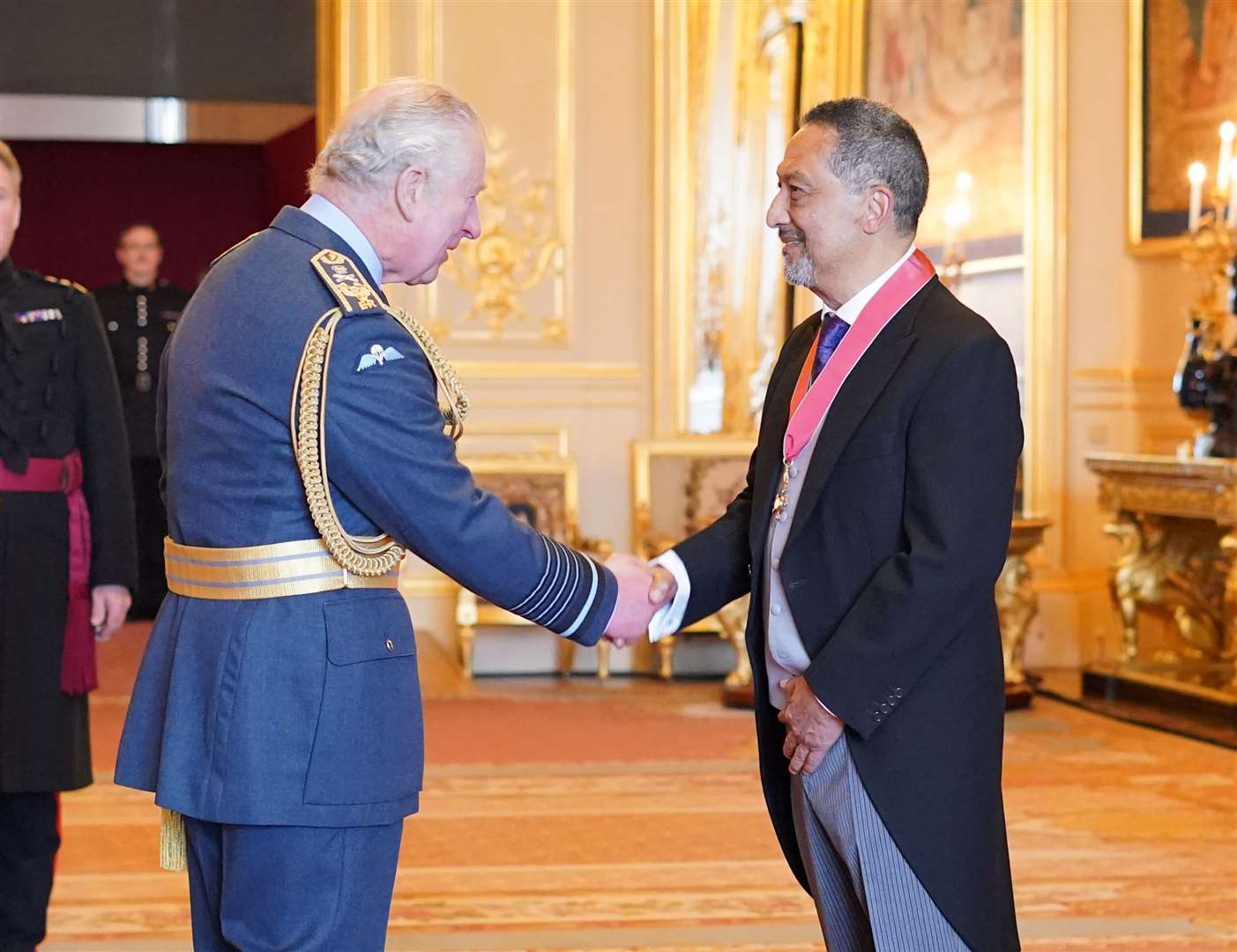 Charles pictured hosting an investiture ceremony on the day he met the Queen (Jonathan Brady/PA)