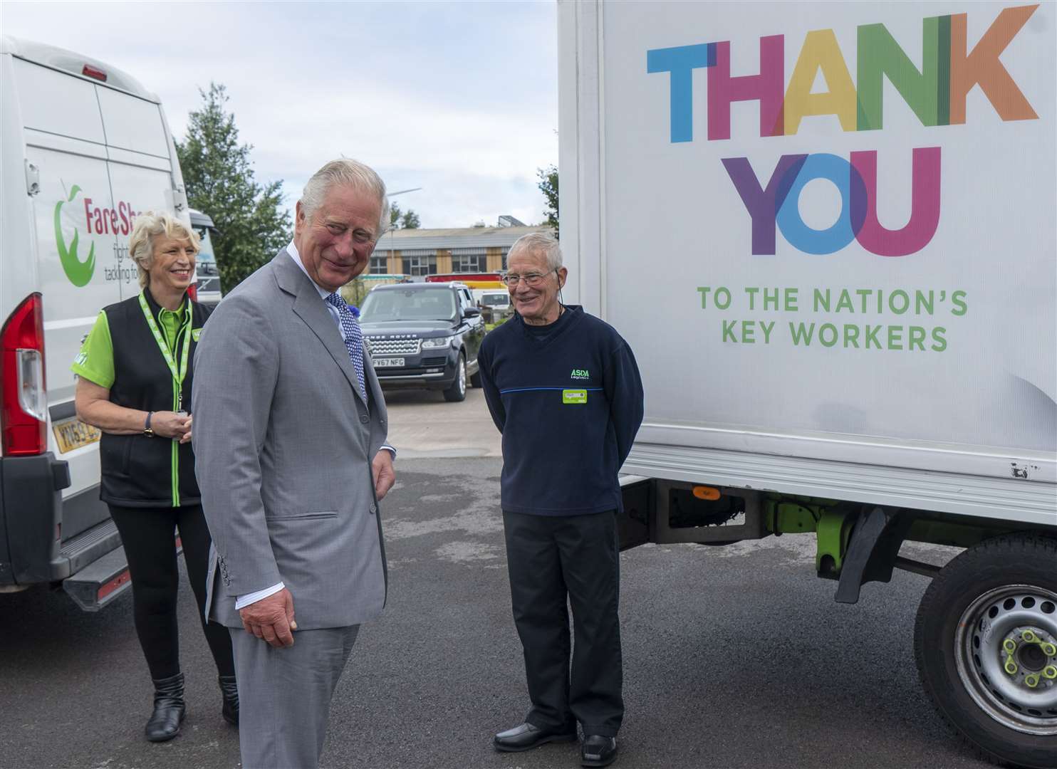 Charles with Asda staff members (Arthur Edwards/The Sun/PA)