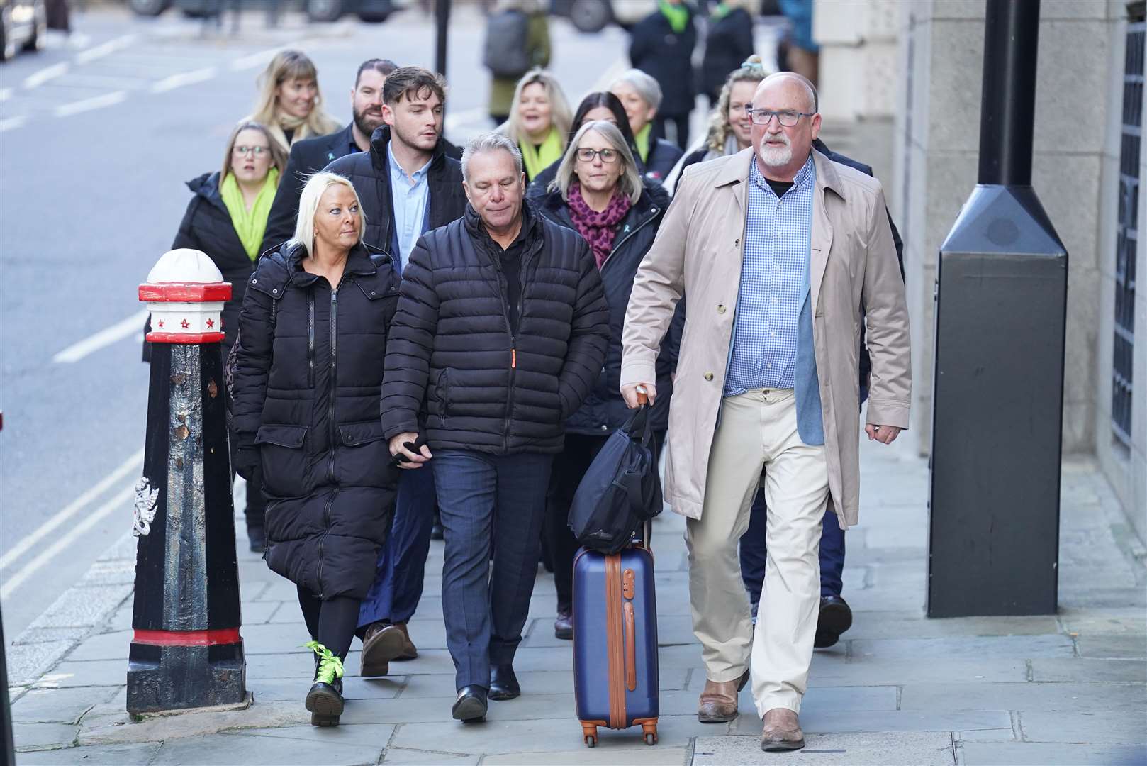 The family of Harry Dunn, mother Charlotte Charles (front left), stepfather Bruce Charles (front centre) and family adviser Radd Seiger (front right), at the Old Bailey, London, (James Manning/PA)