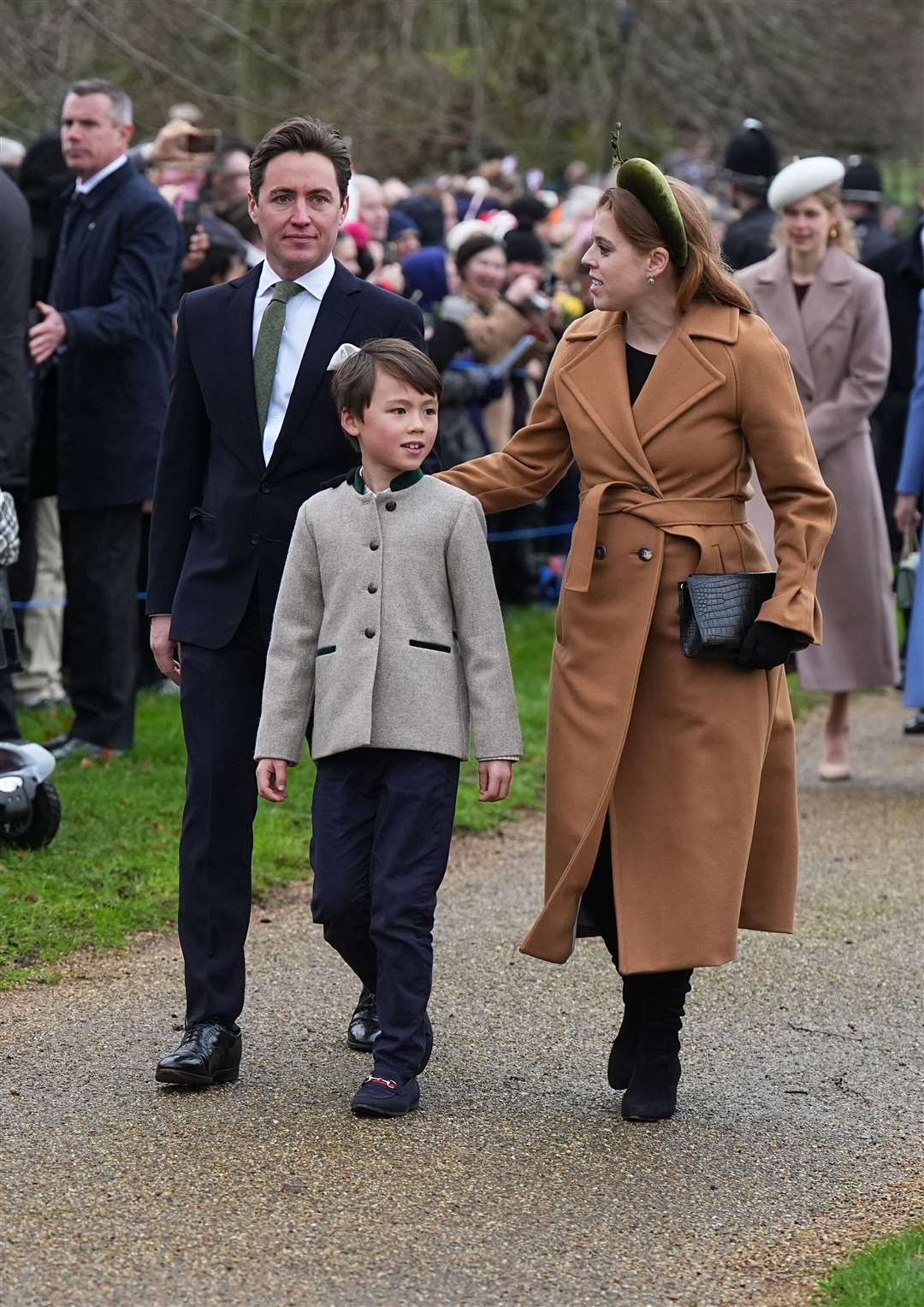 Princess Beatrice, Edoardo Mapelli Mozzi and Wolfie walk to the church in Sandringham (Aaron Chown/PA)