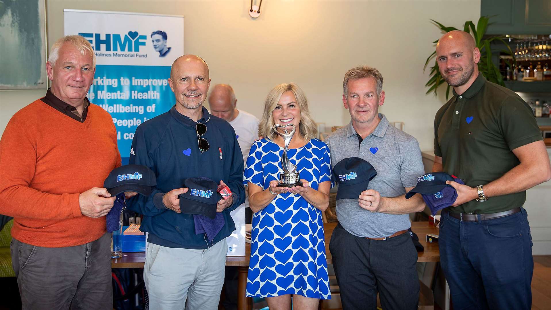 Winning teem, Three off the Tree. From left to right: Dave Plumb, Paul Lowndes, Kerry Holmes presenting the trophy, Dave Homneyman and Jon Taylor. Photo: Elliott Holmes Memorial Fund