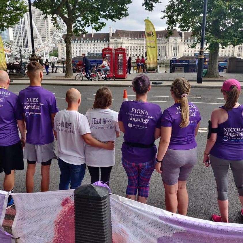 Spectators cheer runners on