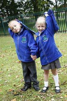 Britains youngest surviving premature twins Gracie and Mikey Swindell celebrate their first week at school.